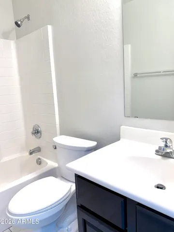 a view of hallway with wooden floor