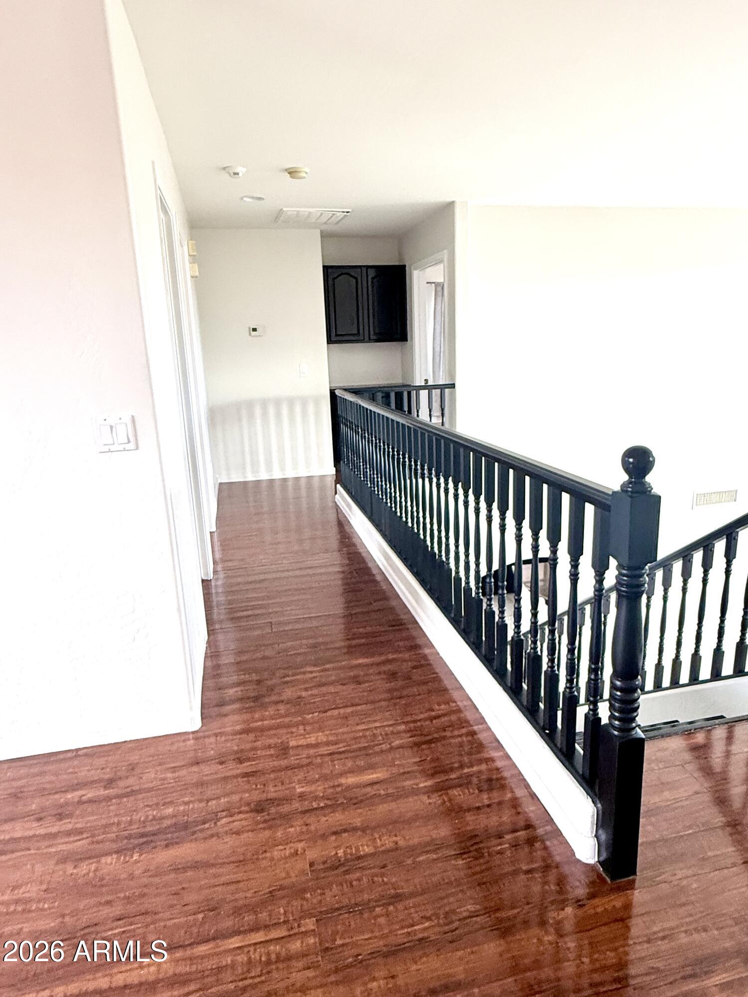 2326 West Gaby Road Phoenix, AZ 85041 - Photo 50 of 75 a view of hallway with wooden floor