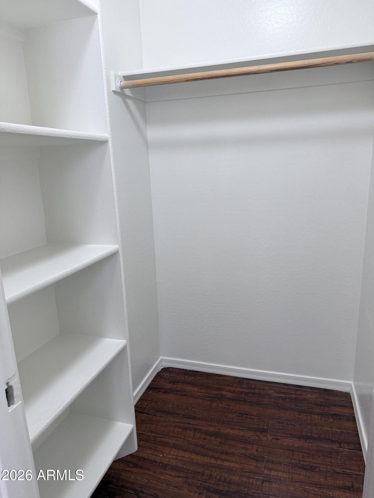 2326 West Gaby Road Phoenix, AZ 85041 - Photo 54 of 75 a view of an empty walk in closet