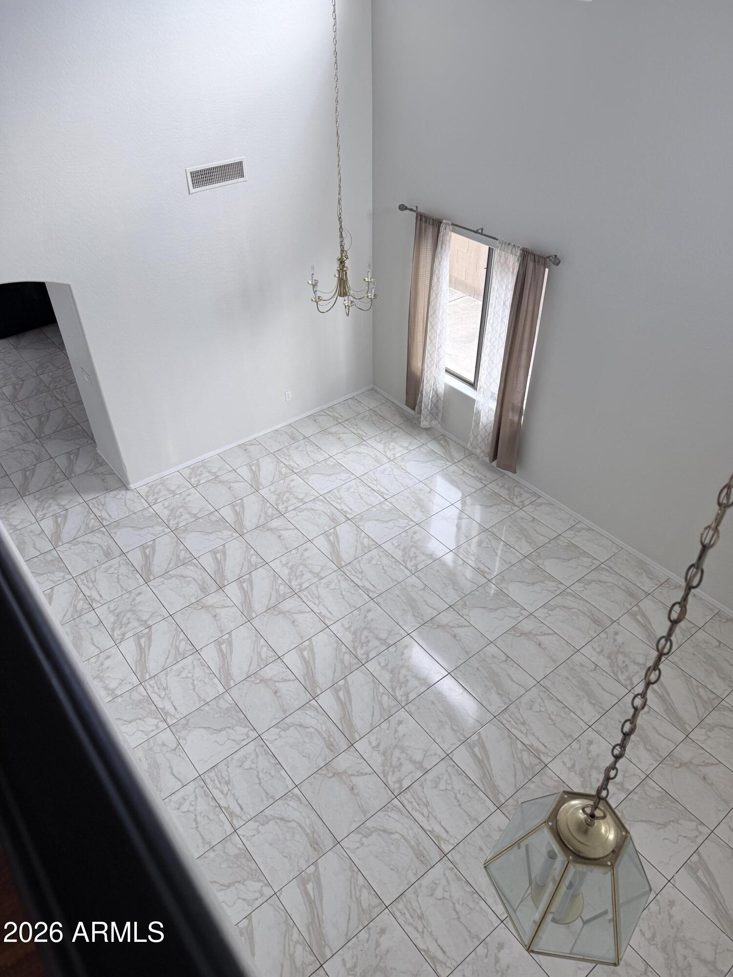 2326 West Gaby Road Phoenix, AZ 85041 - Photo 60 of 75 a view of wooden floor and windows in a room