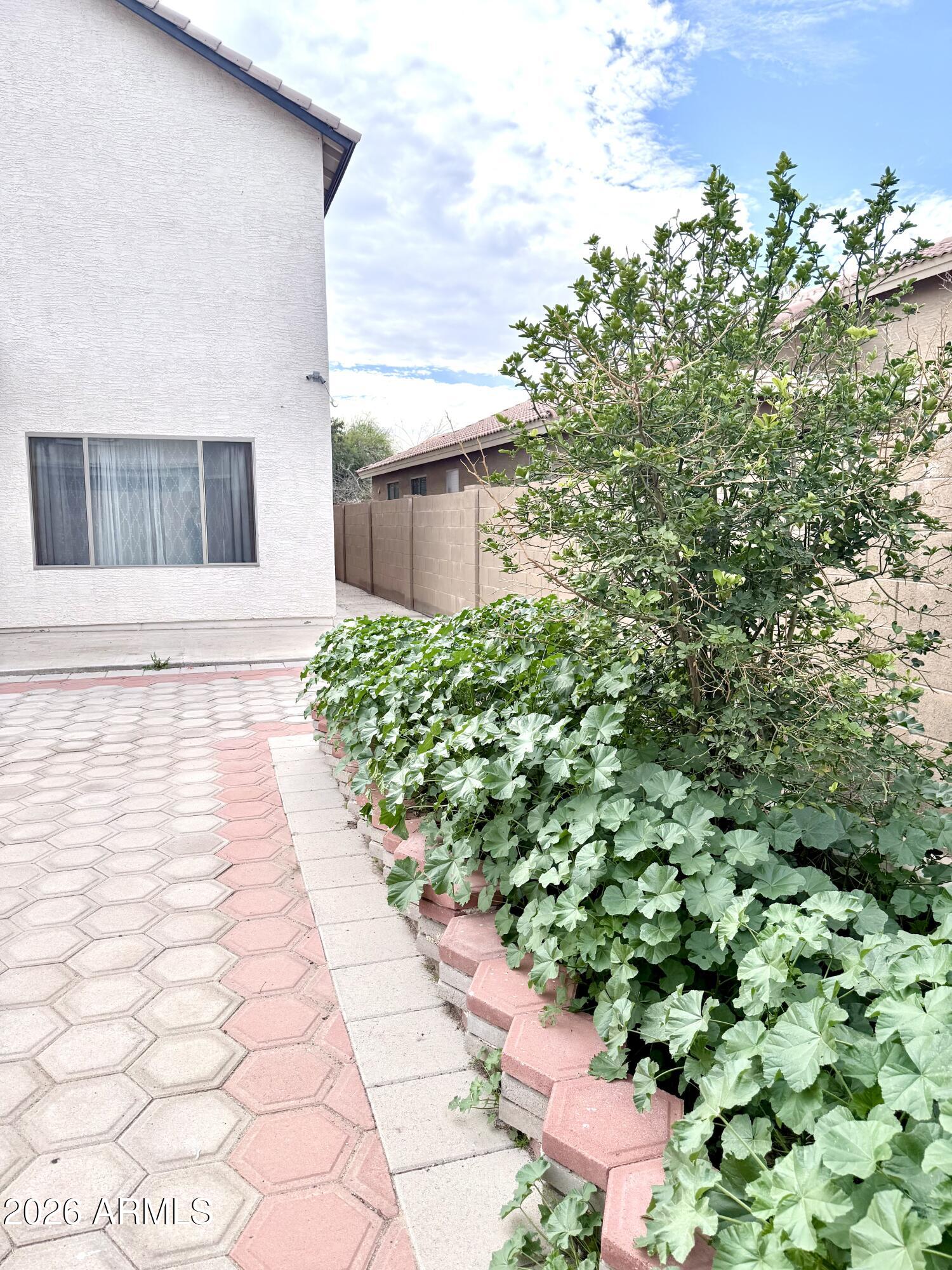 2326 West Gaby Road Phoenix, AZ 85041 - Photo 68 of 75 a view of a yard with plants