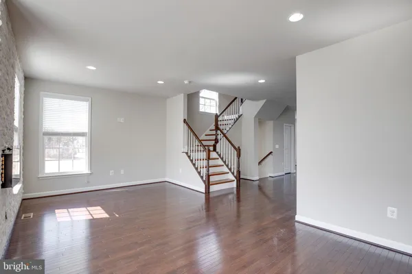 a view of an entryway with wooden floor