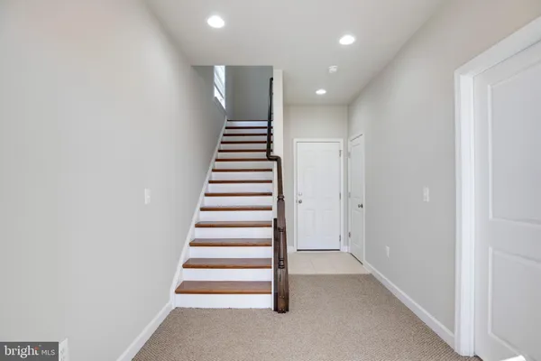 a view of entryway with stairs
