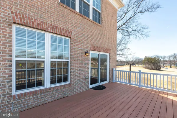 a view of a house with a large window and wooden floor