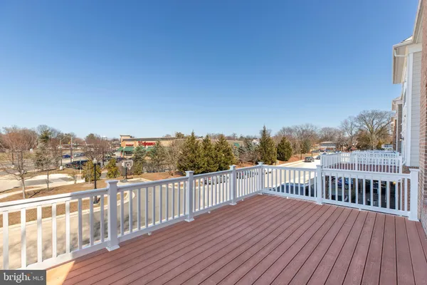 a view of a balcony with wooden floor