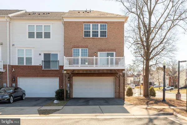 a front view of residential houses with yard