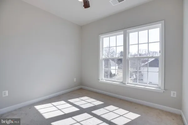 a view of an empty room and window
