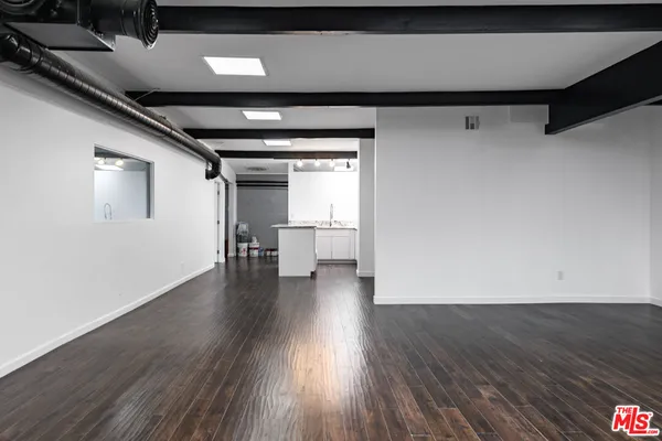 a view of a livingroom with wooden floor