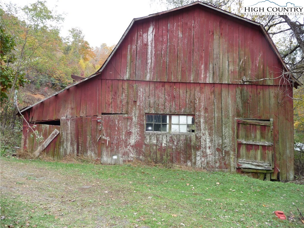 3240 Meat Camp Road Todd, NC 28684 - Photo 5 of 21 a backyard of a house with lots of green space