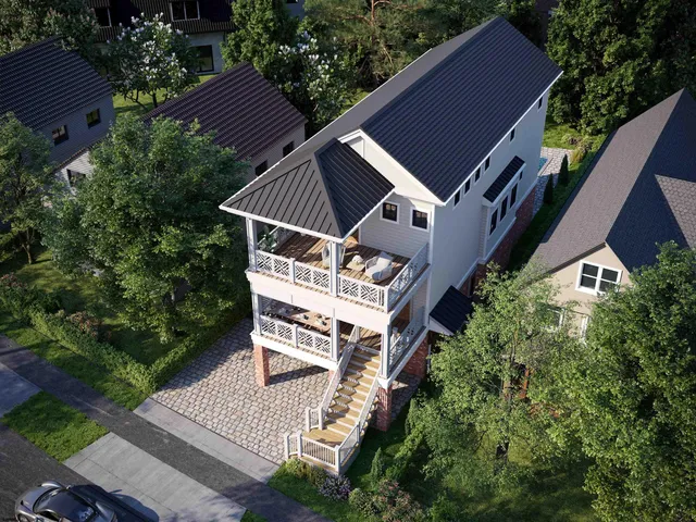 an aerial view of a house with a yard balcony and garden
