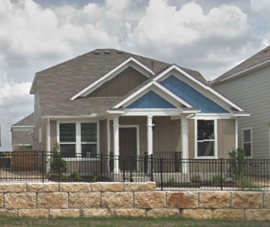 5408 Golden Canary Lane, Unit 53 Austin, TX 78723 - Photo 1 of 1 a front view of a house with a garden