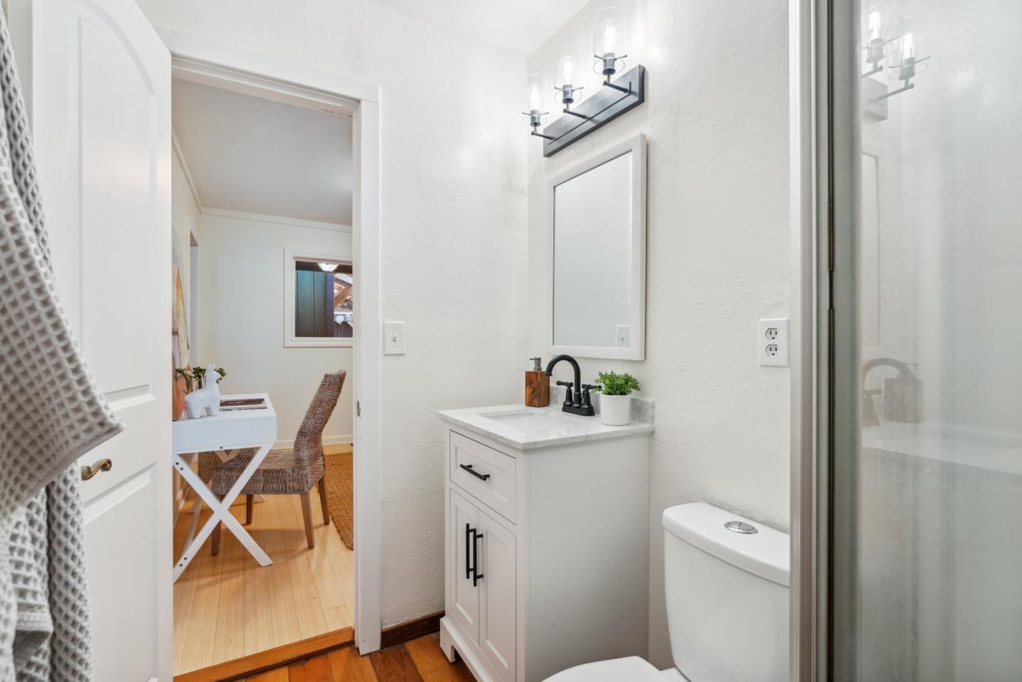 805 Fanning Grde Ben Lomond, CA 95005 - Photo 17 of 60 a bathroom with a sink a toilet and mirror
