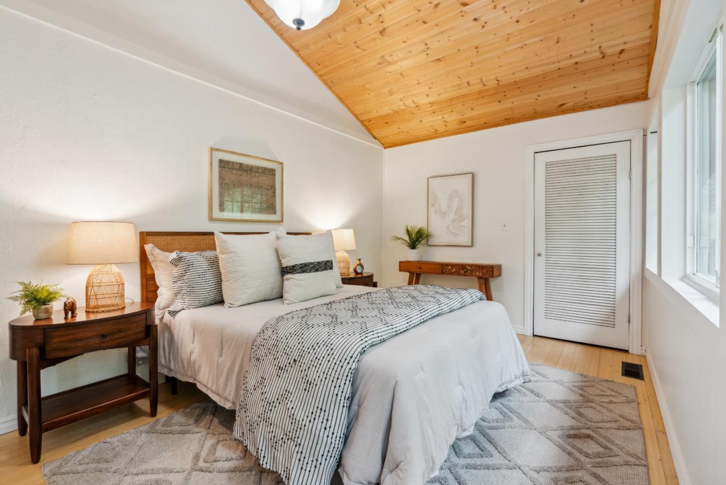 805 Fanning Grde Ben Lomond, CA 95005 - Photo 20 of 60 a bedroom with a bed and a lamp on dresser