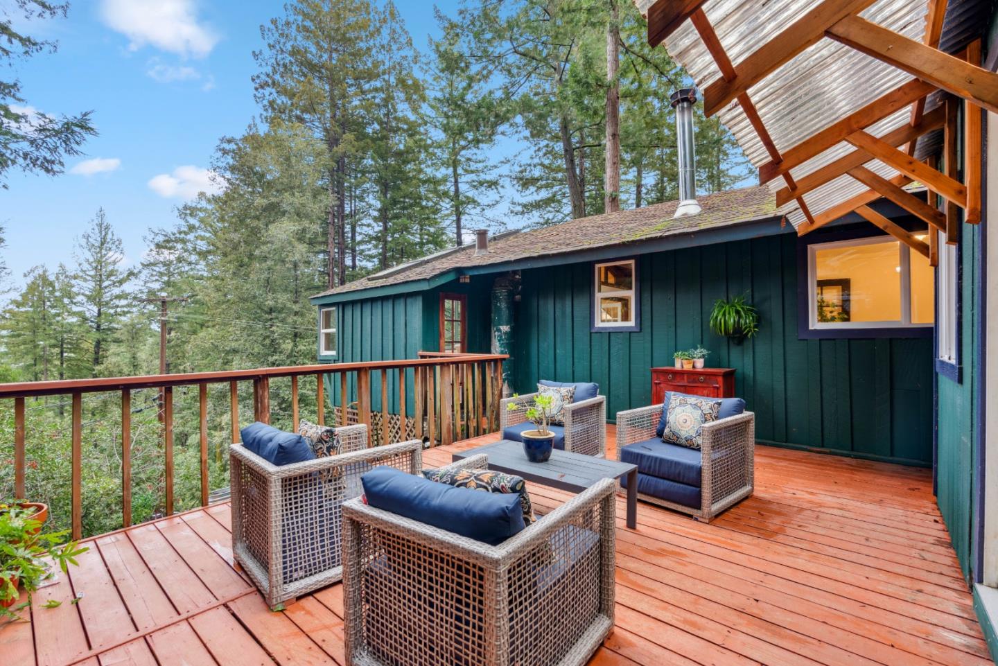 805 Fanning Grde Ben Lomond, CA 95005 - Photo 22 of 60 a balcony with wooden floor and outdoor seating
