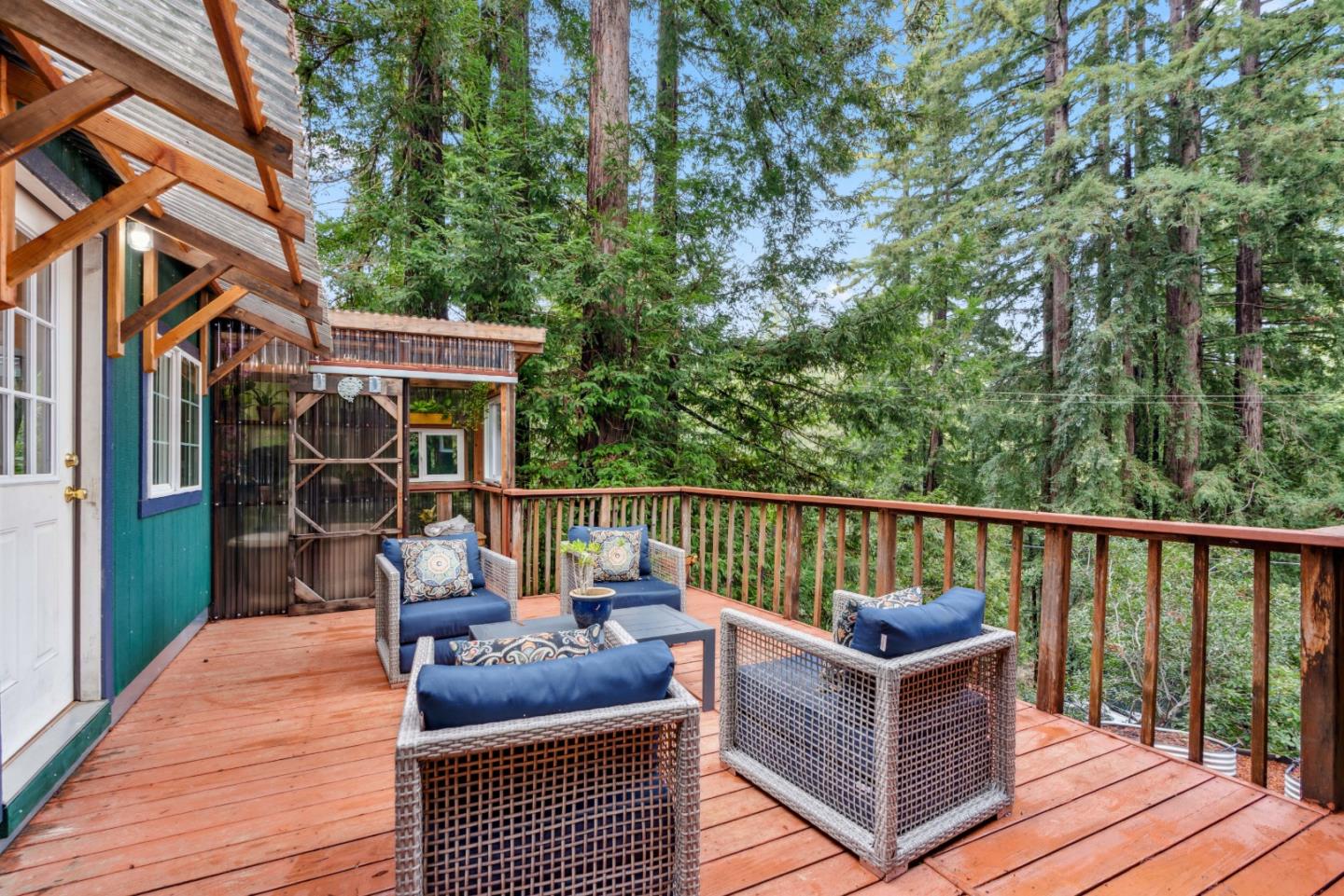 805 Fanning Grde Ben Lomond, CA 95005 - Photo 23 of 60 a balcony with wooden floor and furniture