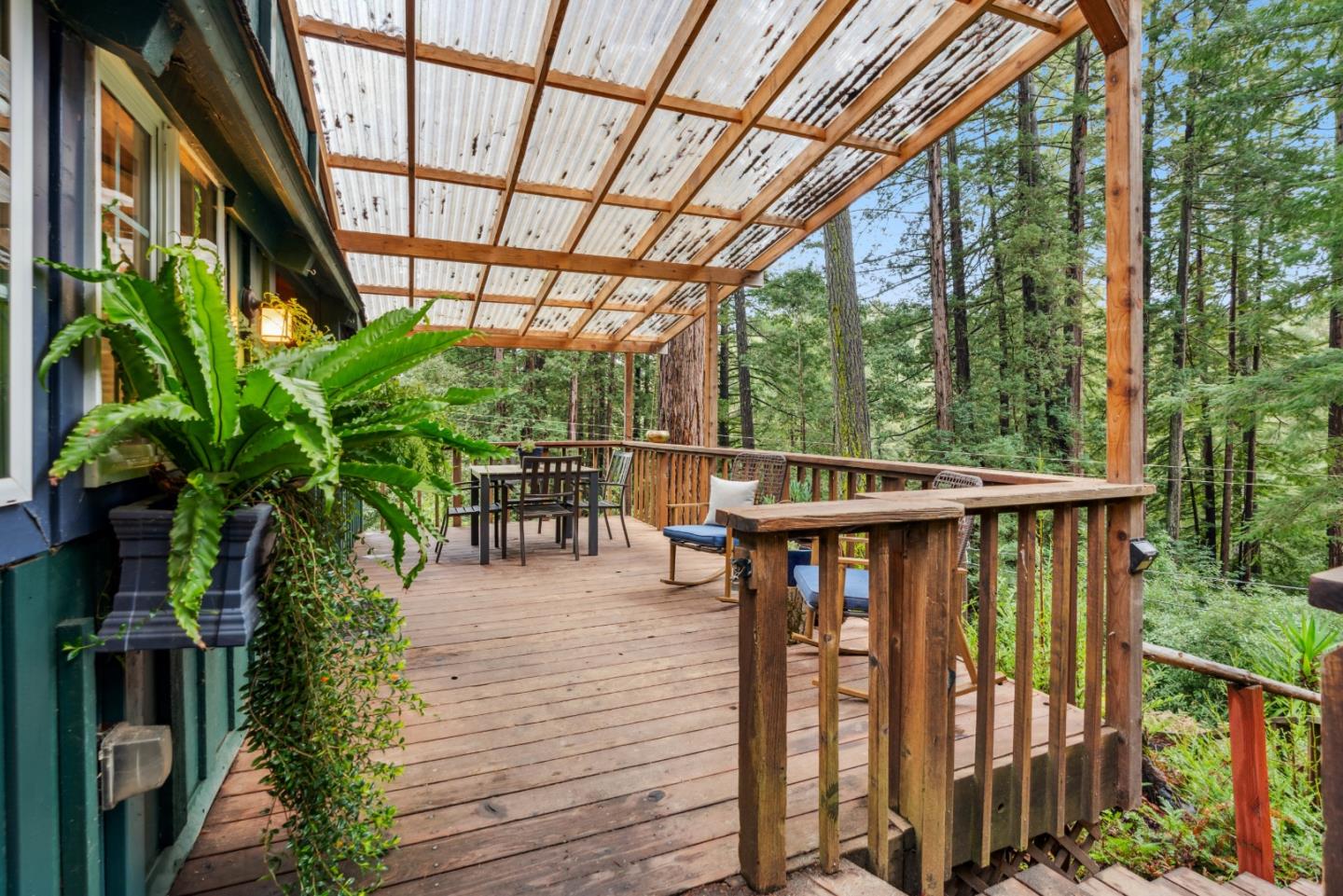 805 Fanning Grde Ben Lomond, CA 95005 - Photo 32 of 60 a view of a balcony with chairs and wooden floor