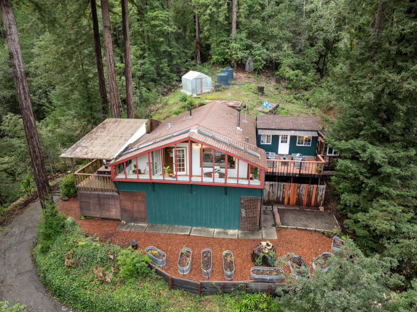 805 Fanning Grde Ben Lomond, CA 95005 - Photo 44 of 60 a aerial view of a house with swimming pool next to a yard