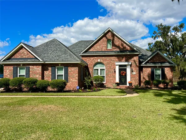 a front view of a house with a yard