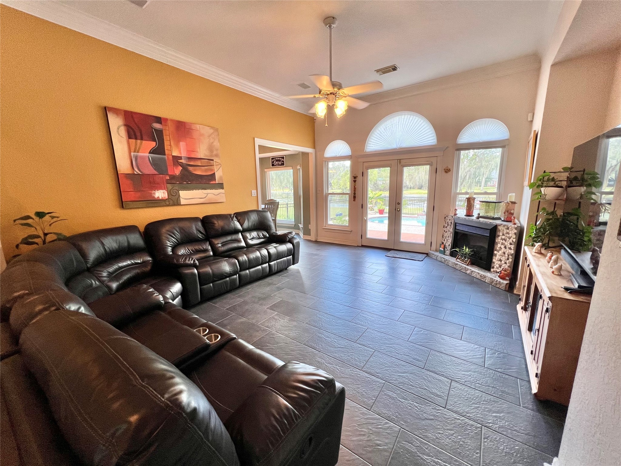 150 Cornelia Lane Angleton, TX 77515 - Photo 11 of 45 a living room with furniture fireplace and a flat screen tv