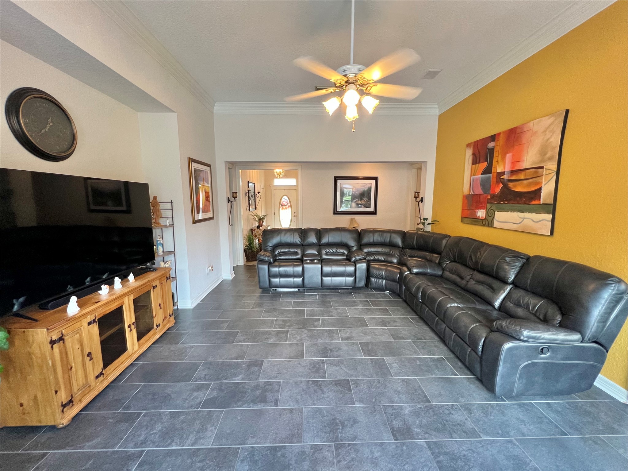 150 Cornelia Lane Angleton, TX 77515 - Photo 12 of 45 a living room with furniture and a flat screen tv