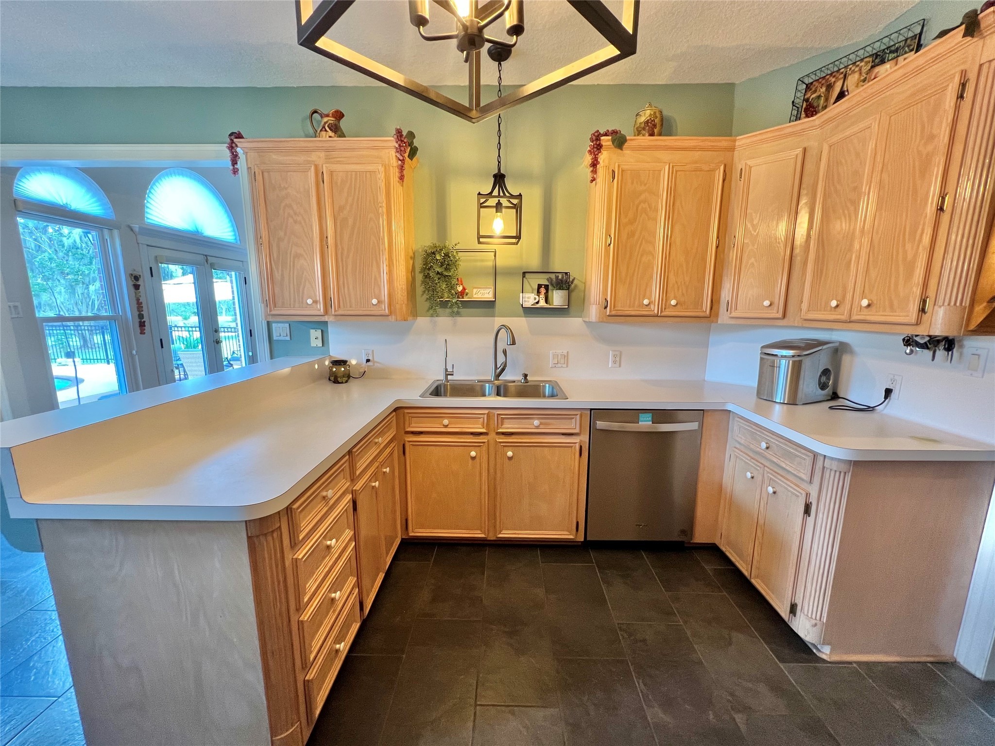 150 Cornelia Lane Angleton, TX 77515 - Photo 17 of 45 a kitchen with a sink and cabinets