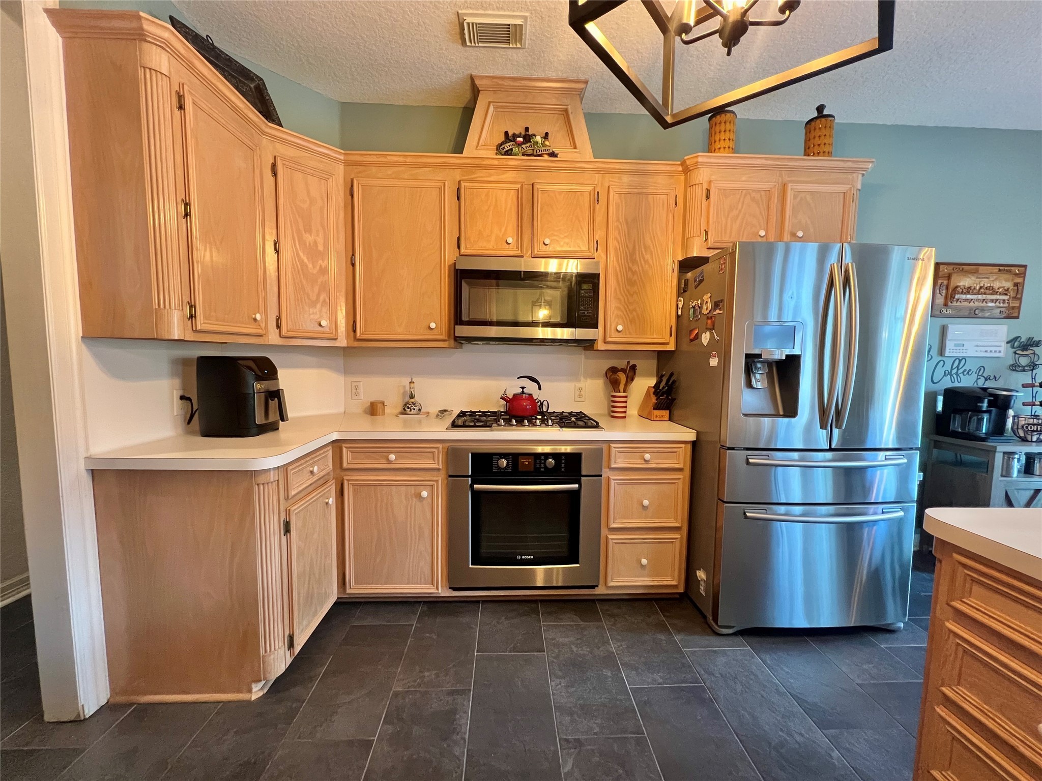150 Cornelia Lane Angleton, TX 77515 - Photo 19 of 45 a kitchen with stainless steel appliances granite countertop a refrigerator and a stove