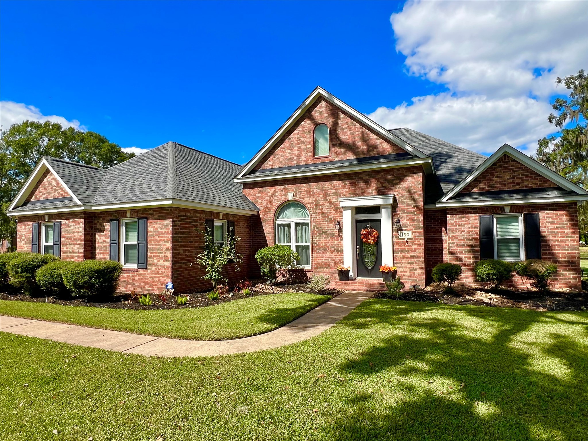 150 Cornelia Lane Angleton, TX 77515 - Photo 2 of 45 a front view of a house with a yard