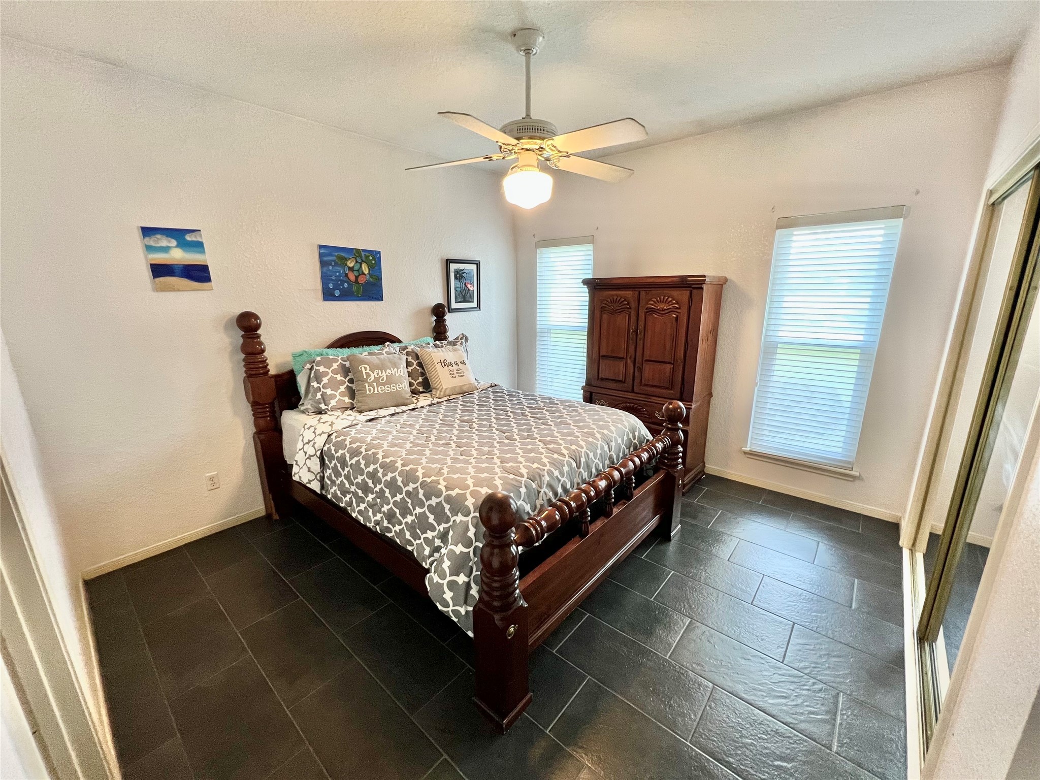 150 Cornelia Lane Angleton, TX 77515 - Photo 24 of 45 a bedroom with a bed lamp and a window