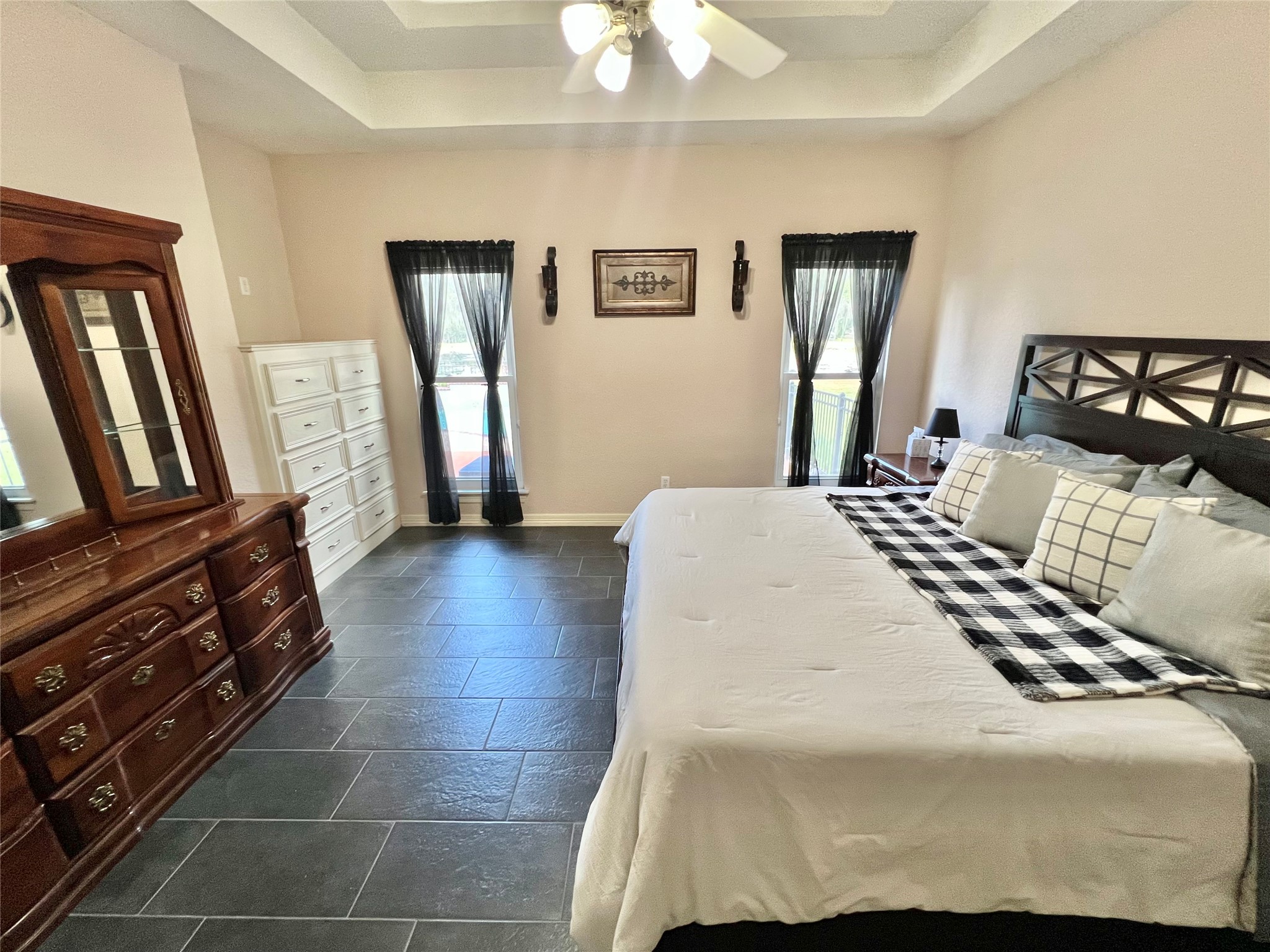 150 Cornelia Lane Angleton, TX 77515 - Photo 27 of 45 a bedroom with a bed and a chandelier