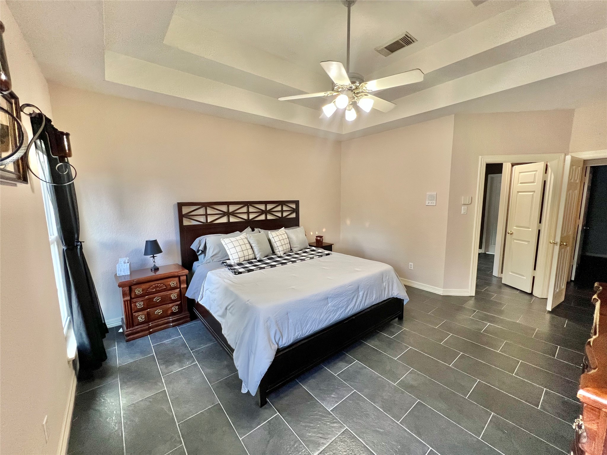150 Cornelia Lane Angleton, TX 77515 - Photo 28 of 45 a bedroom with a bed and a large mirror