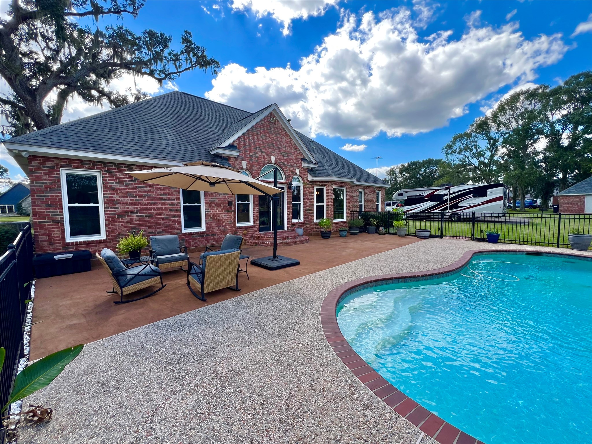 150 Cornelia Lane Angleton, TX 77515 - Photo 35 of 45 a view of a house with swimming pool and sitting area