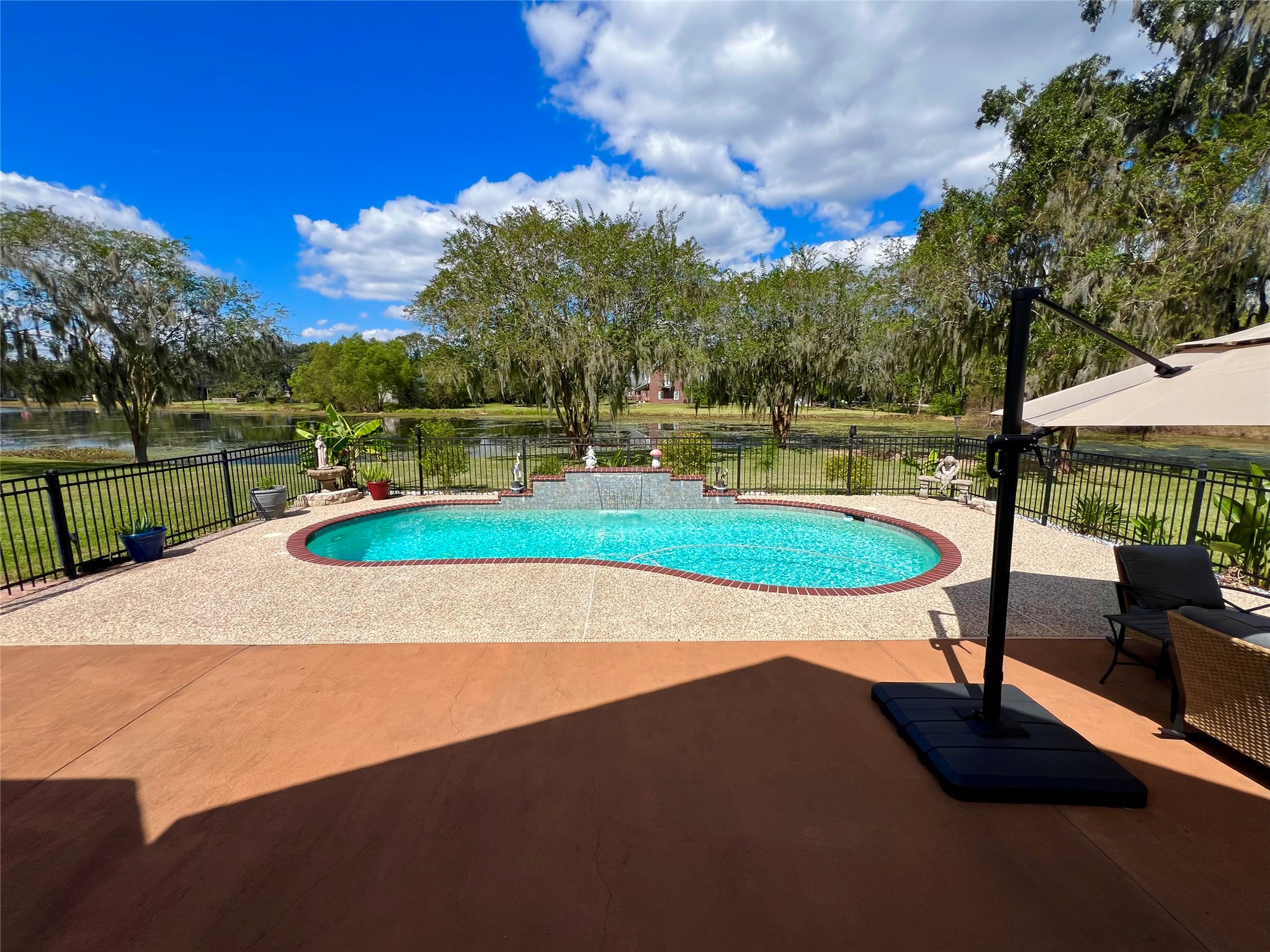 150 Cornelia Lane Angleton, TX 77515 - Photo 38 of 45 a view of a swimming pool with a yard