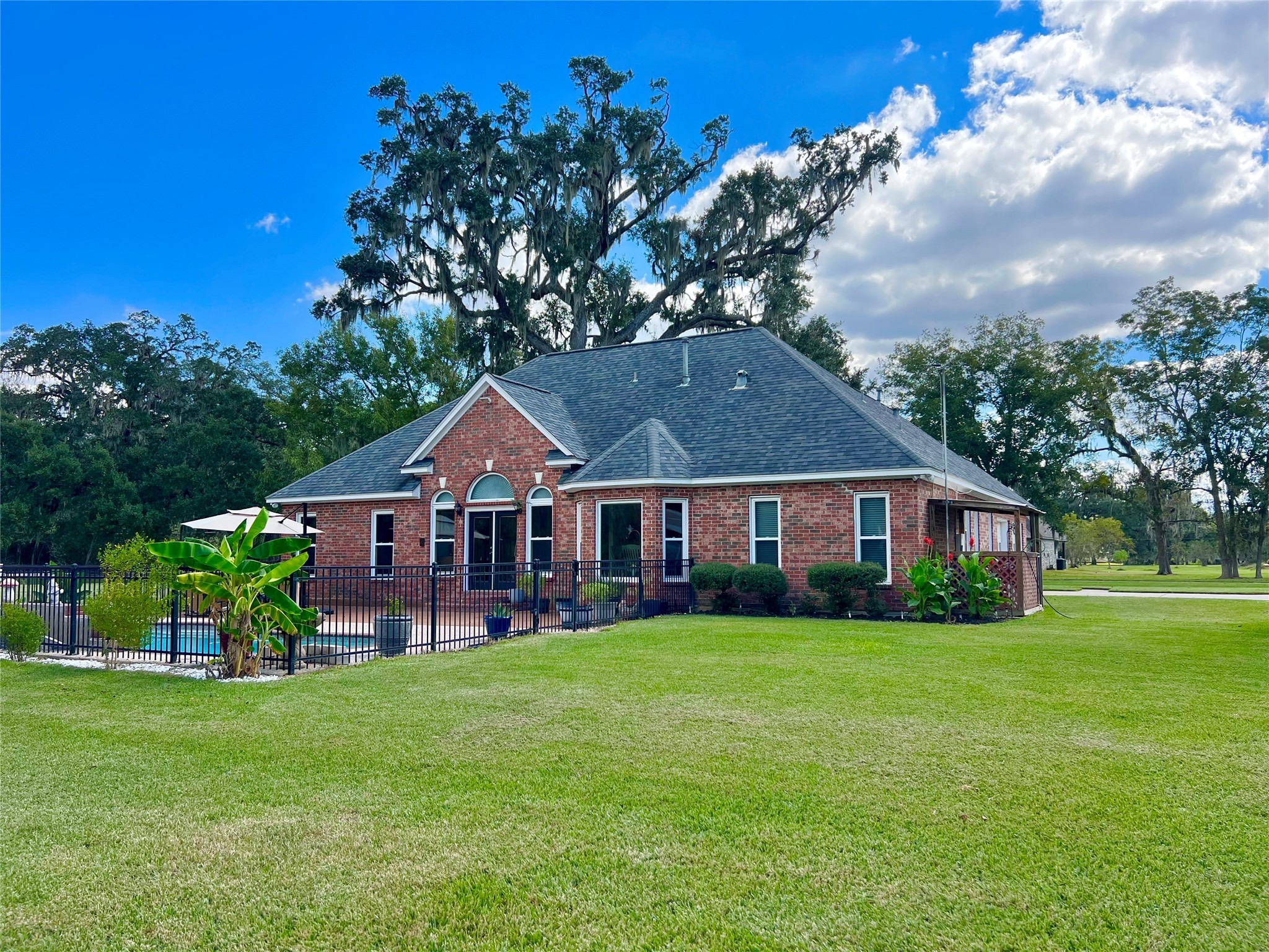 150 Cornelia Lane Angleton, TX 77515 - Photo 40 of 45 a front view of a house with garden