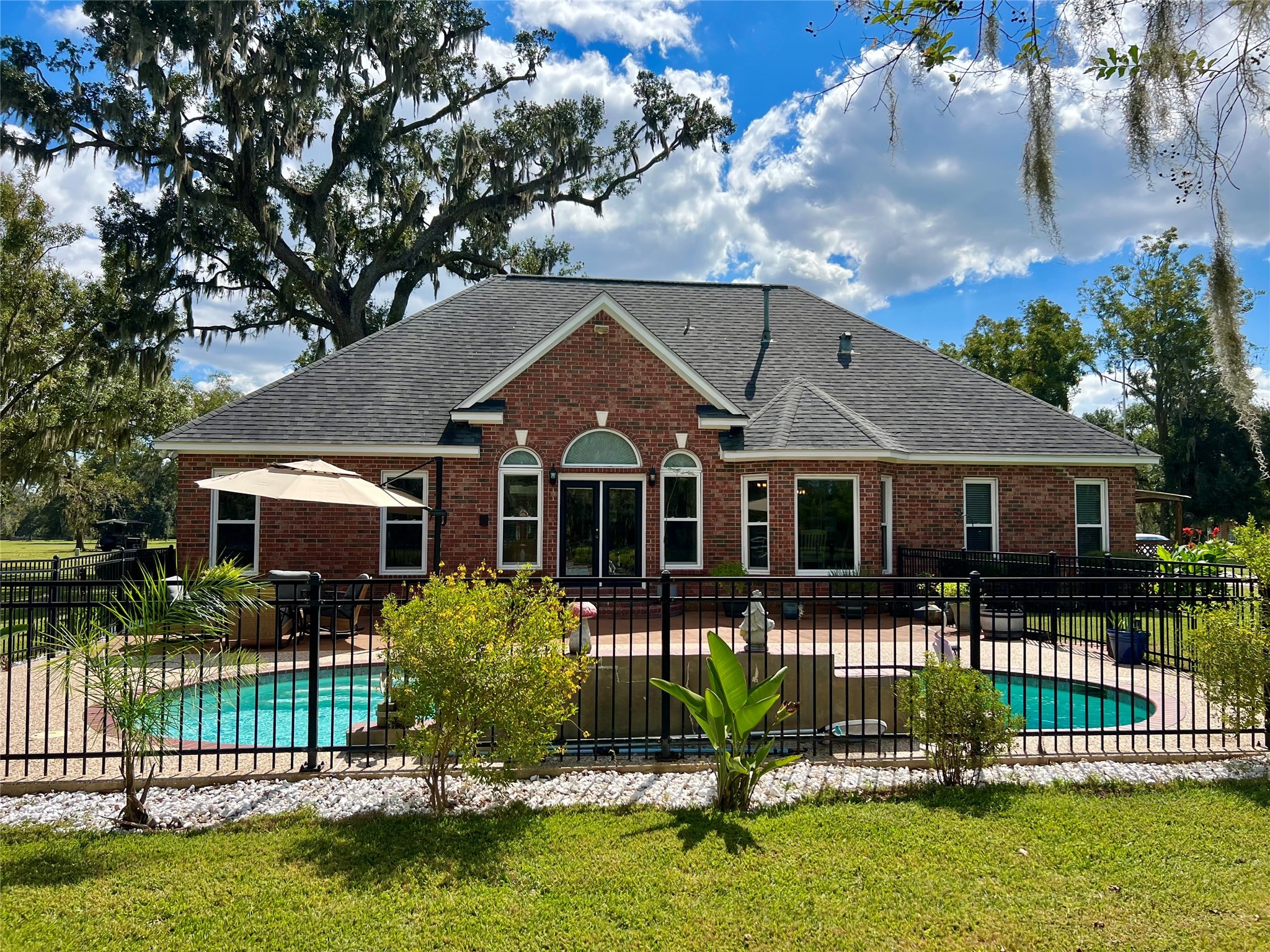 150 Cornelia Lane Angleton, TX 77515 - Photo 42 of 45 a front view of a house with a garden