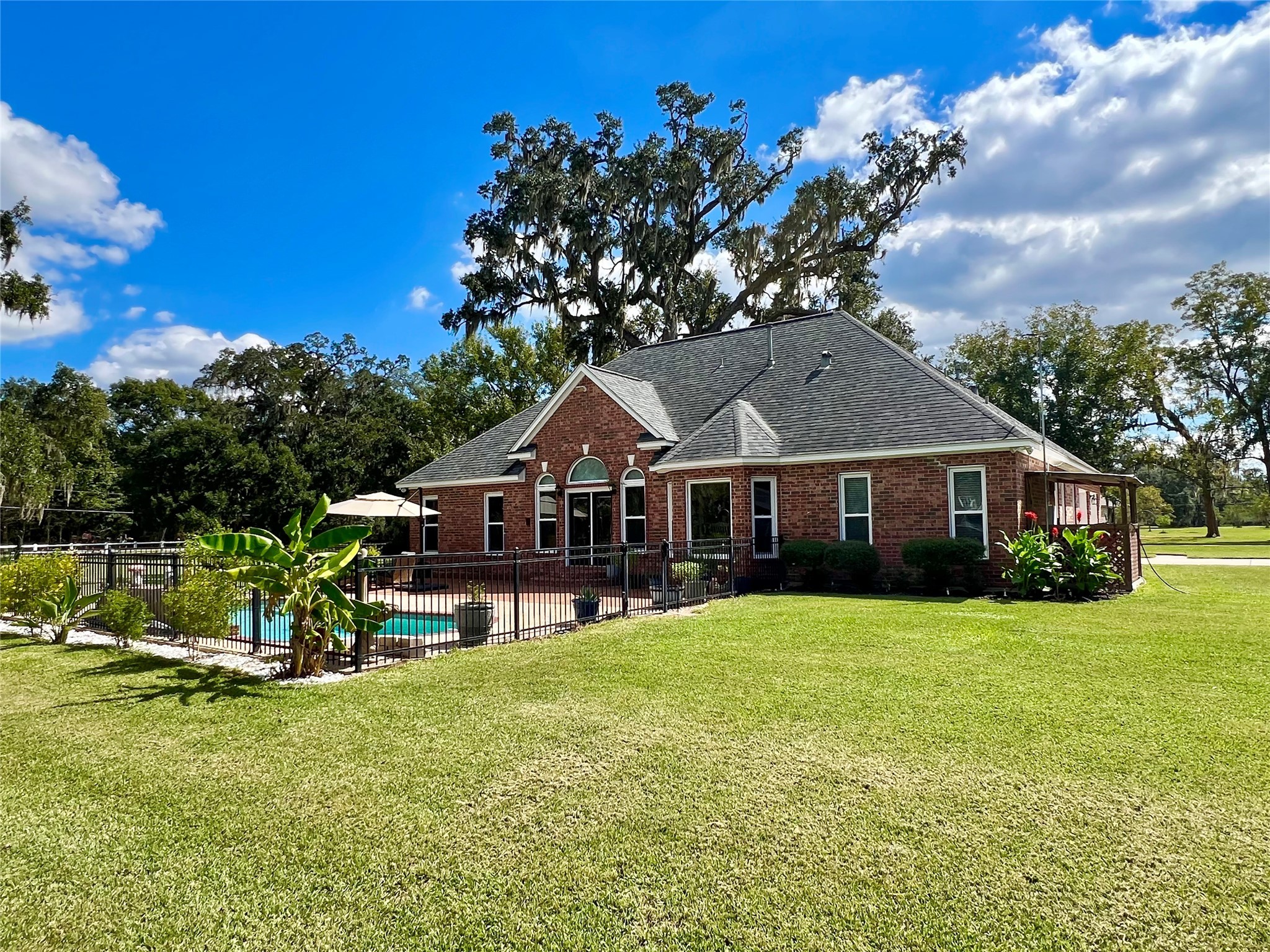 150 Cornelia Lane Angleton, TX 77515 - Photo 43 of 45 a front view of a house with garden