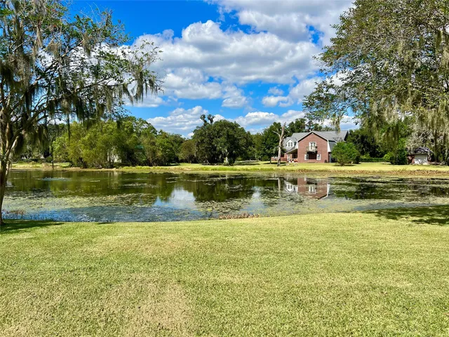 a view of a lake with a big yard
