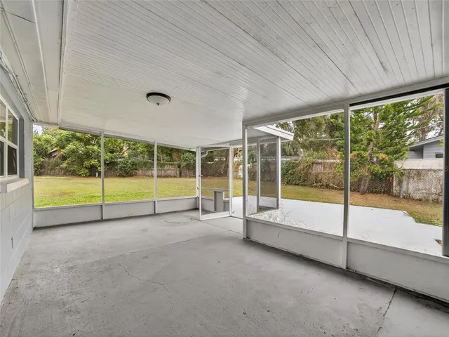 a view of an empty room with a large window
