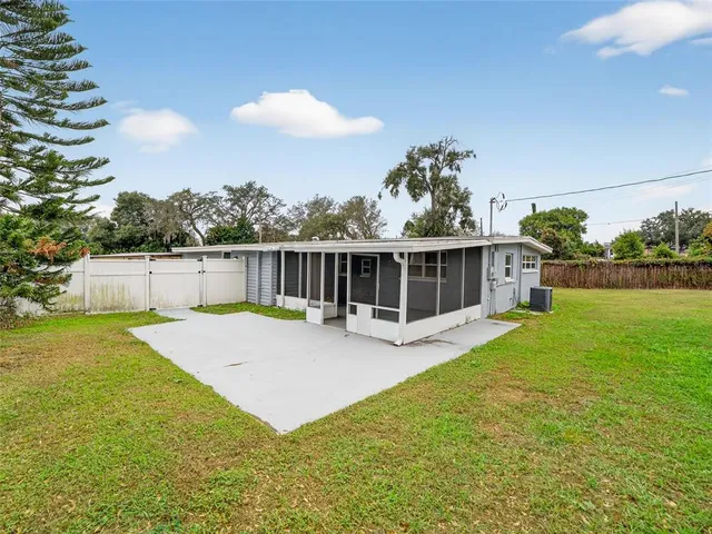 a view of a backyard with plants and a garden