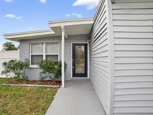 a view of a house with a small yard