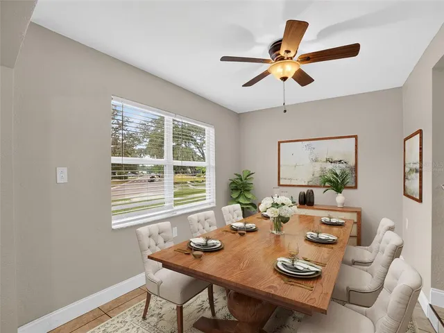 a view of a dining room with furniture window and outside view