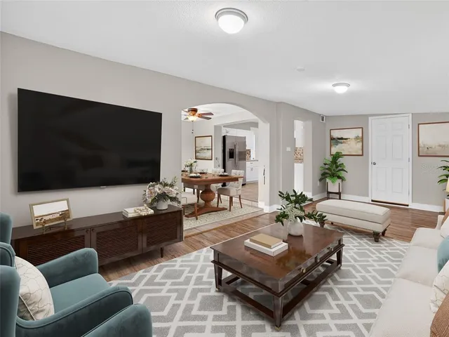 a living room with furniture and a flat screen tv