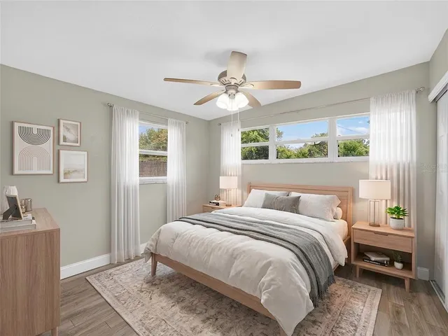 a bedroom with a bed and a chandelier