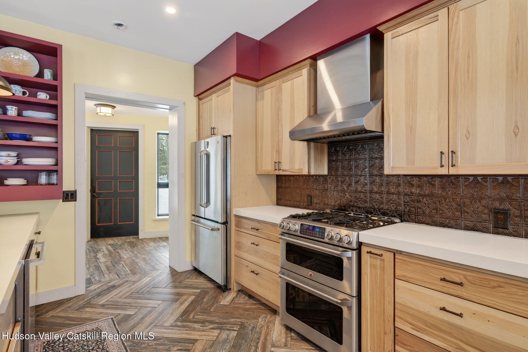 1045 Church Road Saugerties, NY 12477 - Photo 14 of 56 a kitchen with stainless steel appliances granite countertop a stove and a refrigerator