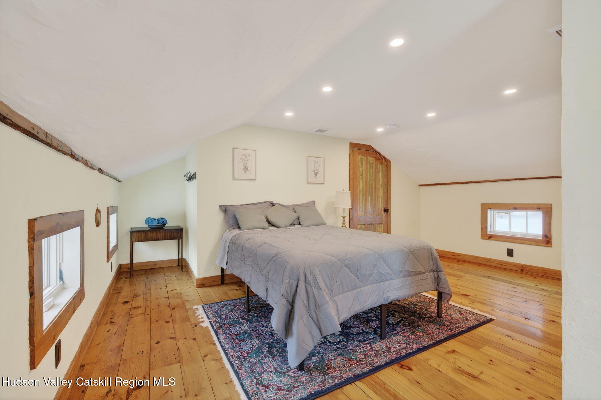 1045 Church Road Saugerties, NY 12477 - Photo 36 of 56 a spacious bedroom with a bed and a table