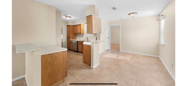 a view of empty room with fireplace