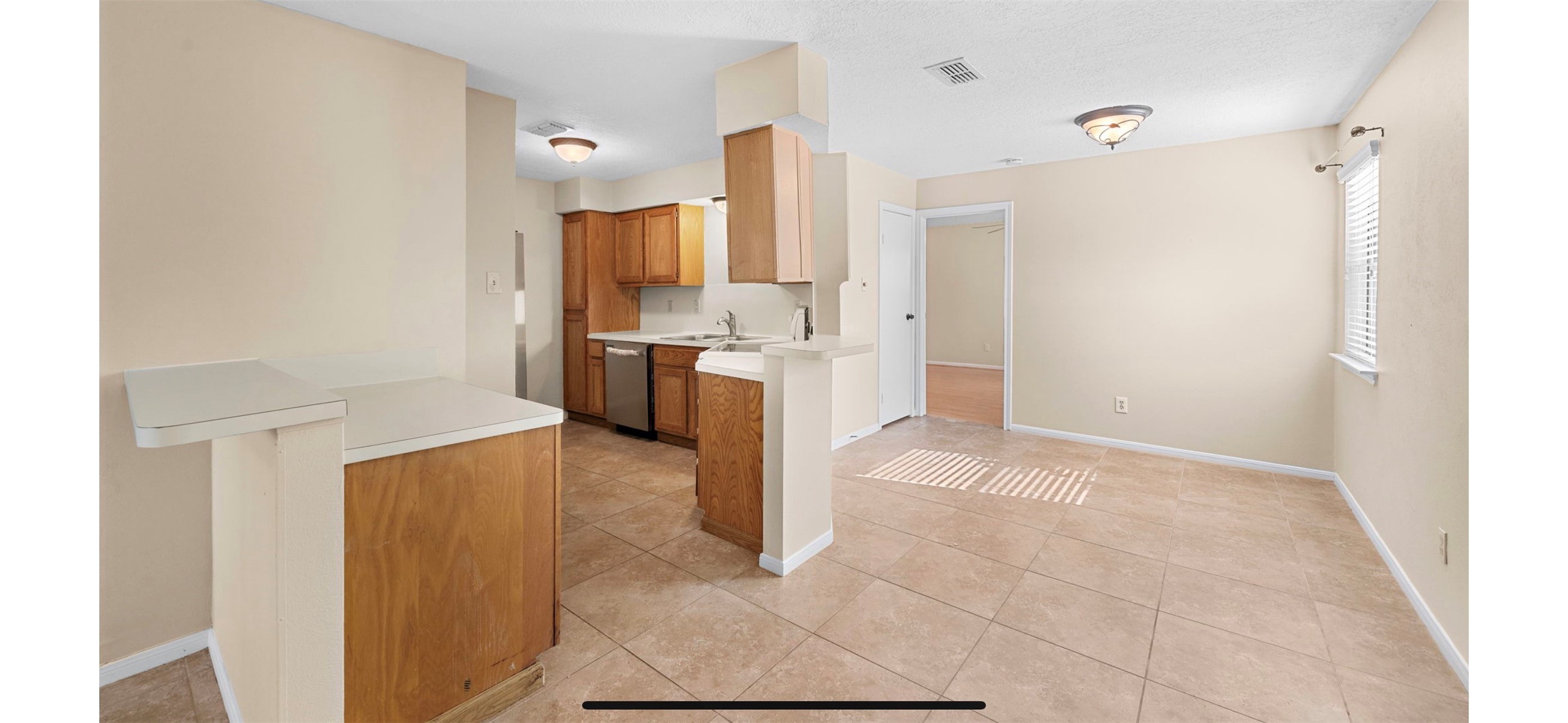 12755 Mill Ridge Drive, Unit 202 Cypress, TX 77429 - Photo 3 of 17 a kitchen with a refrigerator and a stove