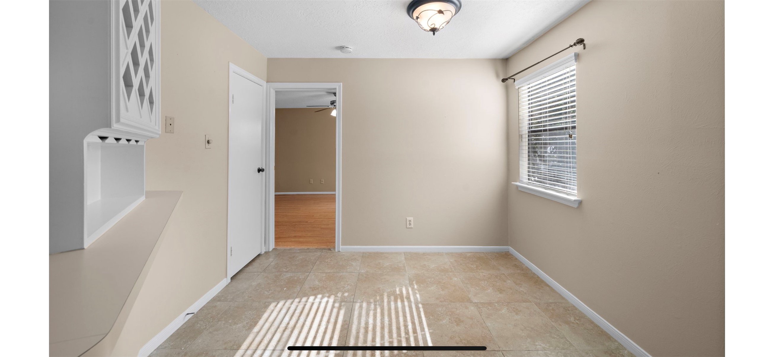 12755 Mill Ridge Drive, Unit 202 Cypress, TX 77429 - Photo 7 of 17 a view of room with window and hardwood floor