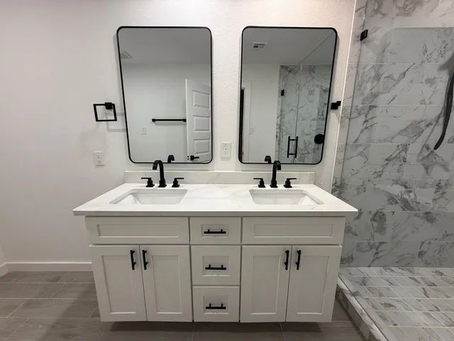 a view of a hallway with wooden floor and entryway