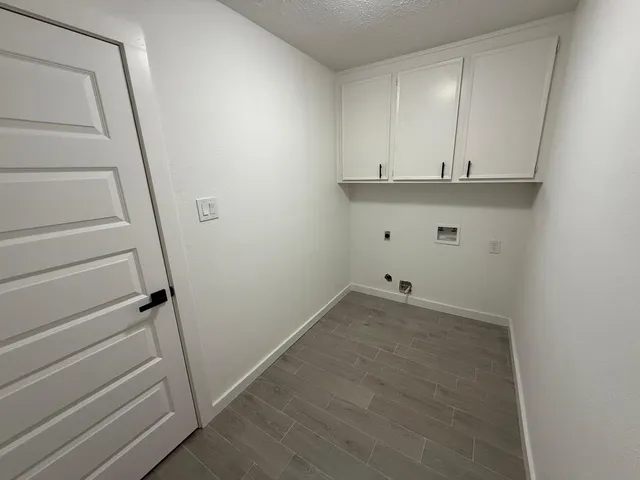 a bathroom with a double vanity sink toilet and mirror