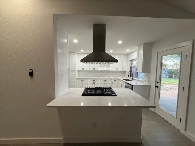 a kitchen with a sink and a refrigerator